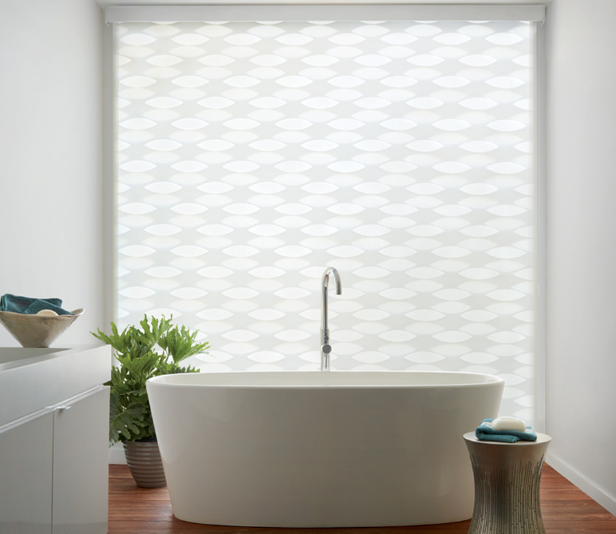 bathroom with standalone tub and hunter douglas white designer banded shades Cleveland OH