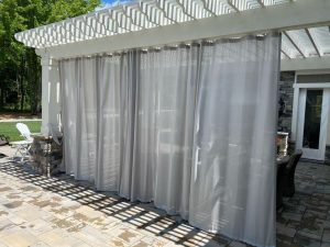 gray draperies on pergola in Chagrin Falls OH