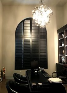 black shutters on arched window in dining room in Chagrin Falls OH