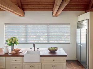 kitchen window with multiple shades and wand motorized system in Akron, OH
