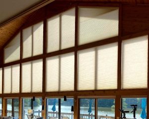 duette honeycomb shades over large angled windows overlooking Ohio river