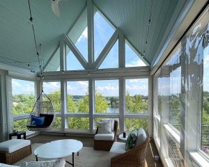enclosed patio sunroom with angled windows and shades in Cleveland, OH
