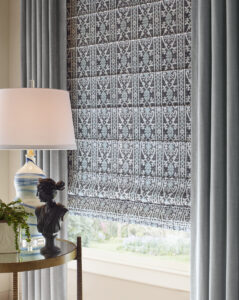 patterned roman shades with solid draperies in Chagrin Falls