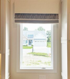 custom roman shade in soft eggshell fabric