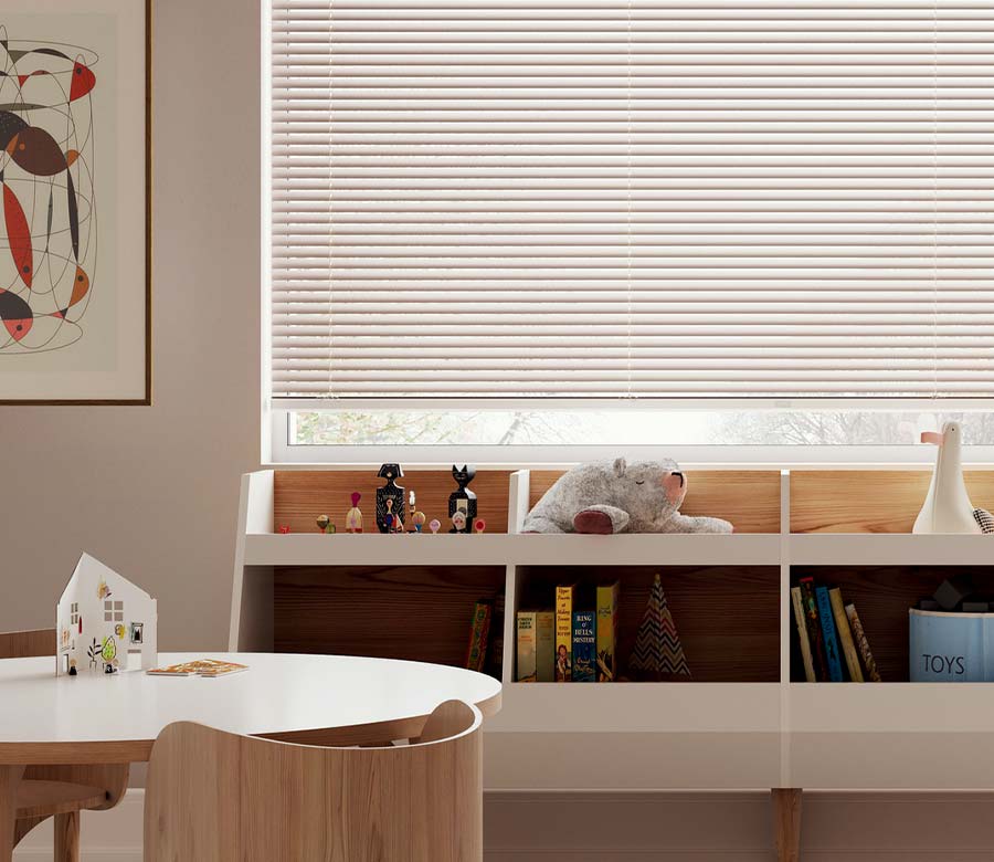 kids playroom with books and toys and beige blinds in Chagrin Falls, OH