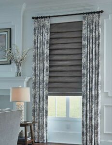 draperies and roman shades are layered fabrics at the window of Westlake OH home