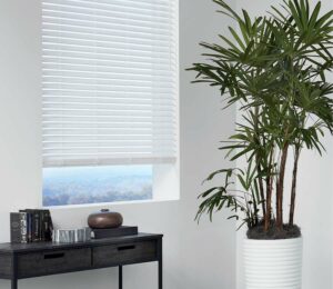 white faux blinds open slightly to see the outdoors Cleveland OH