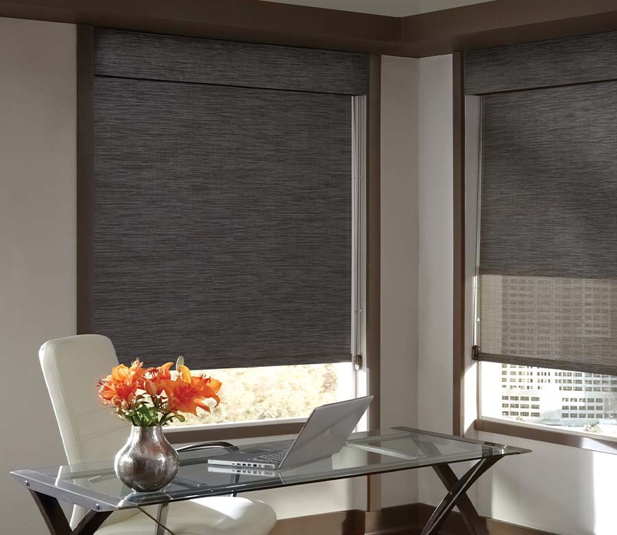 home office in high rise apartment with dark dual shade window screen shade