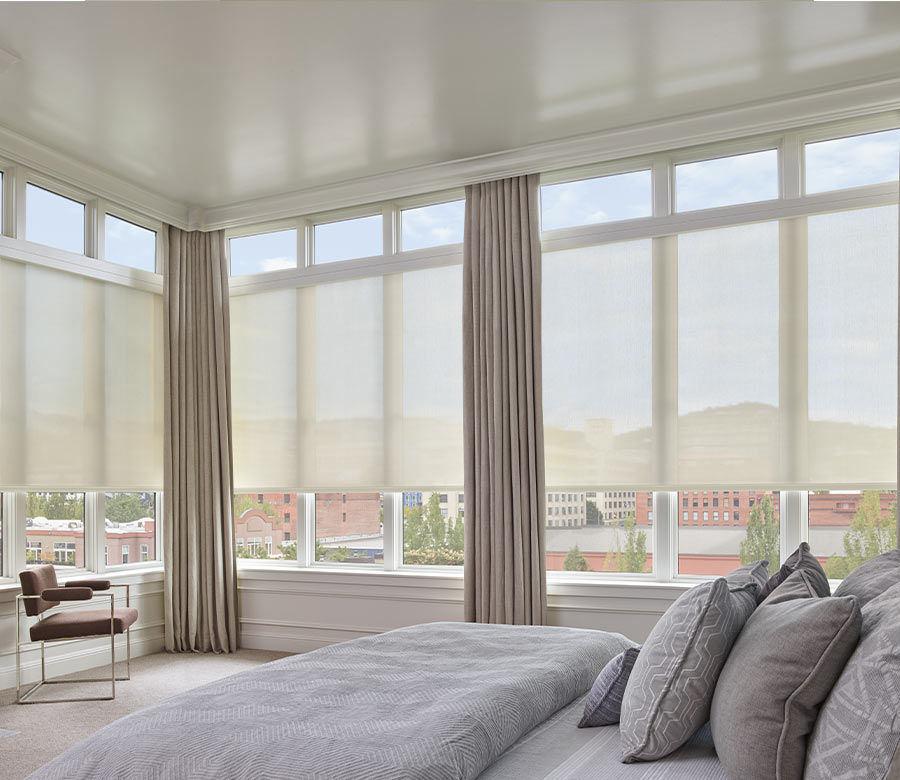 loft apartment in downtown Lakewood OH with large roller shade blinds and beige drapery panels