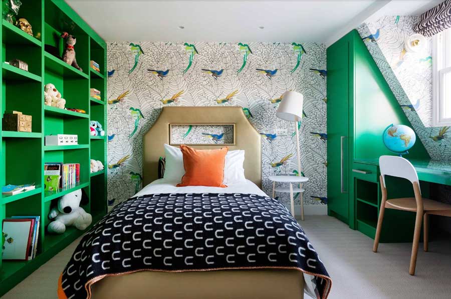 teen's bedroom with green built-in shelving and desk