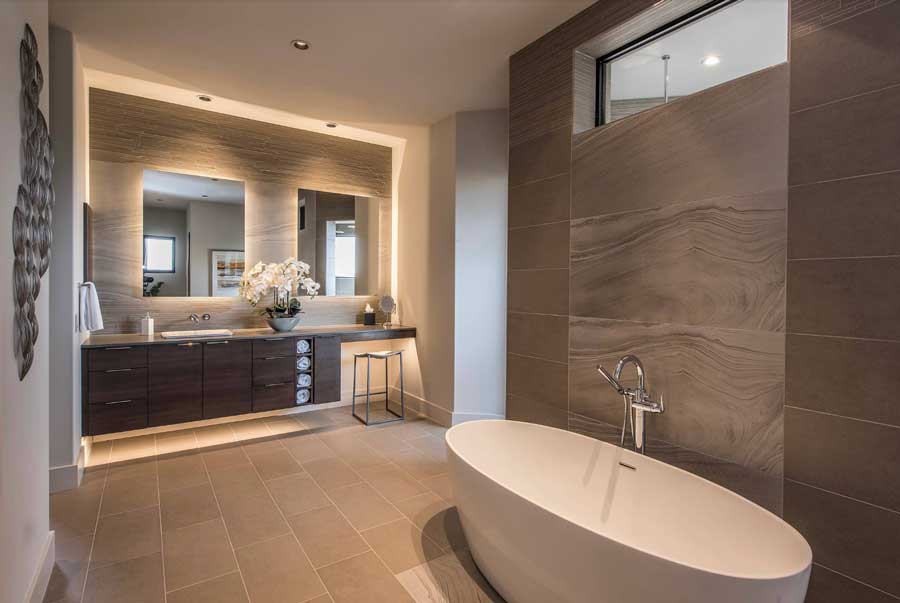 backlit wall in primary bathroom