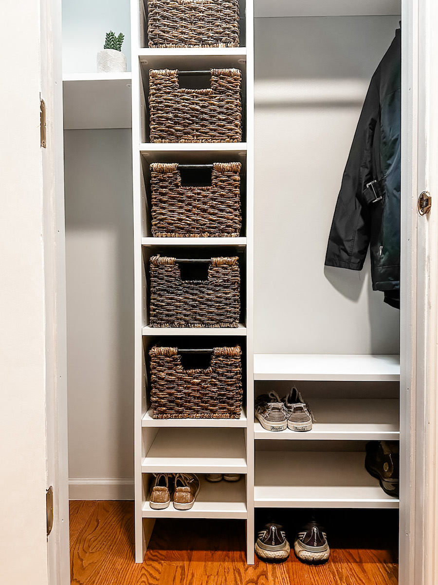 Built in shelving within a closet with baskets that fit perfectly into space