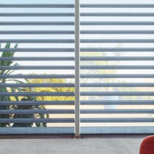 blue floor to ceiling window shades in living room timan and co