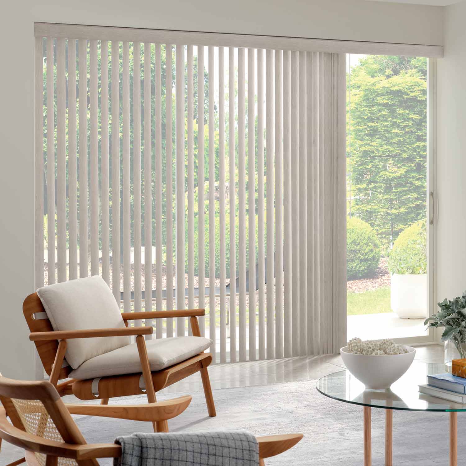 living room with white vertical blinds on patio doors