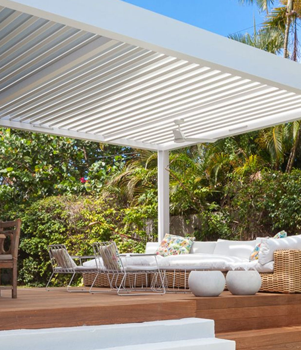 white rblade pergola with fans in the beams