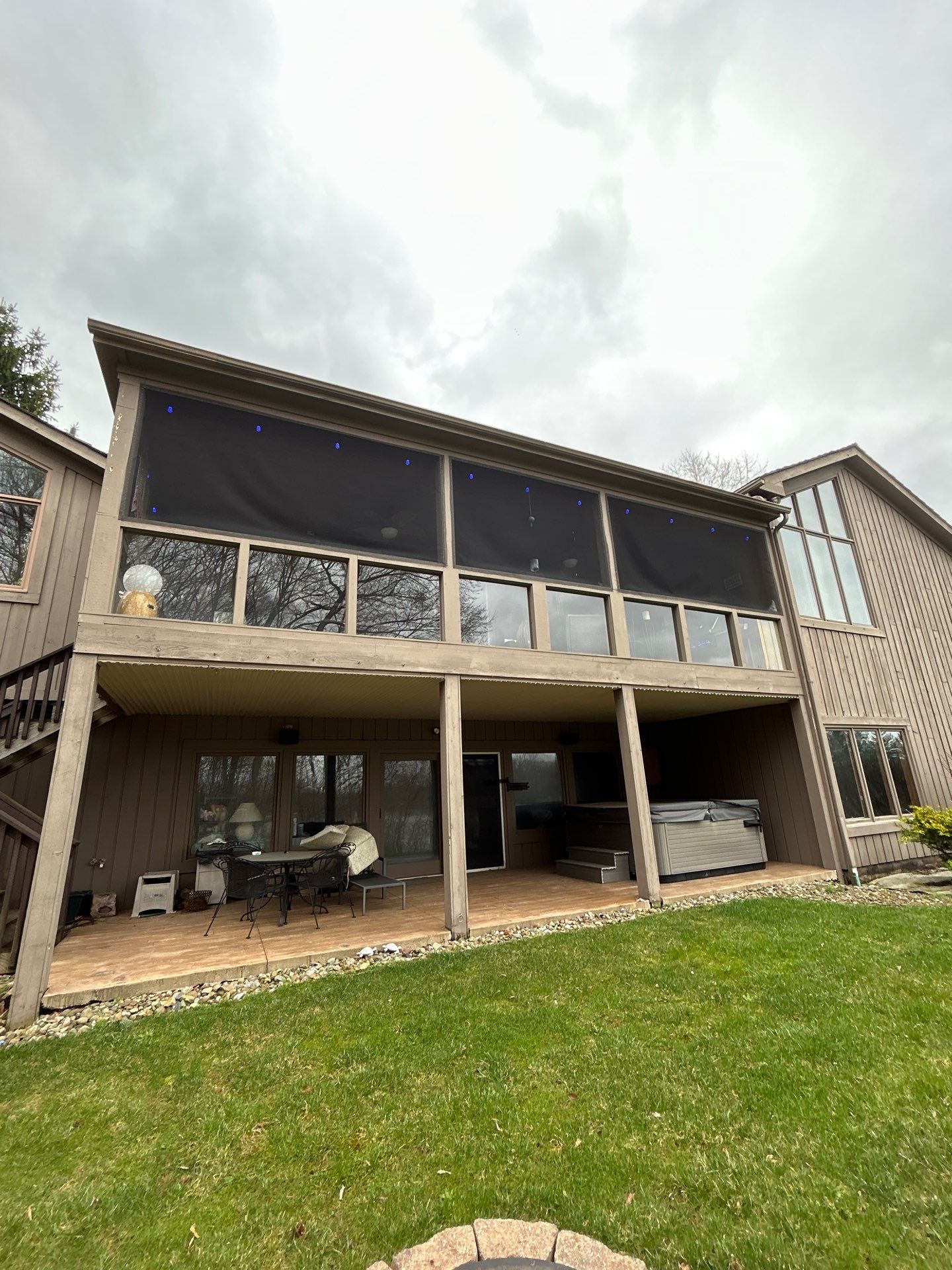 back patio with black screens second floor timan and co