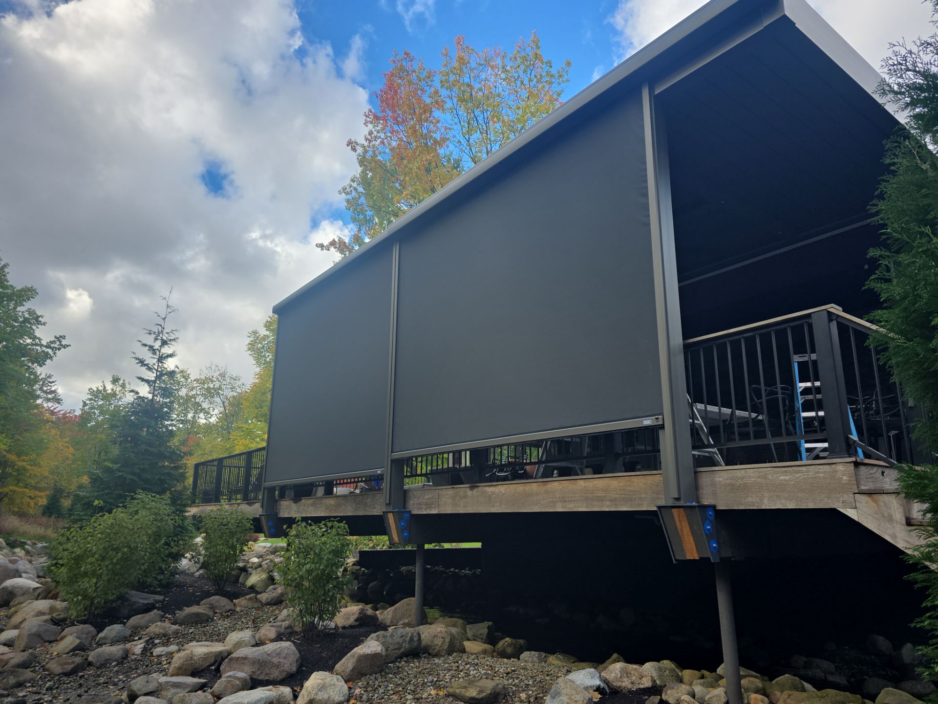 exterior black screens on raised outdoor patio