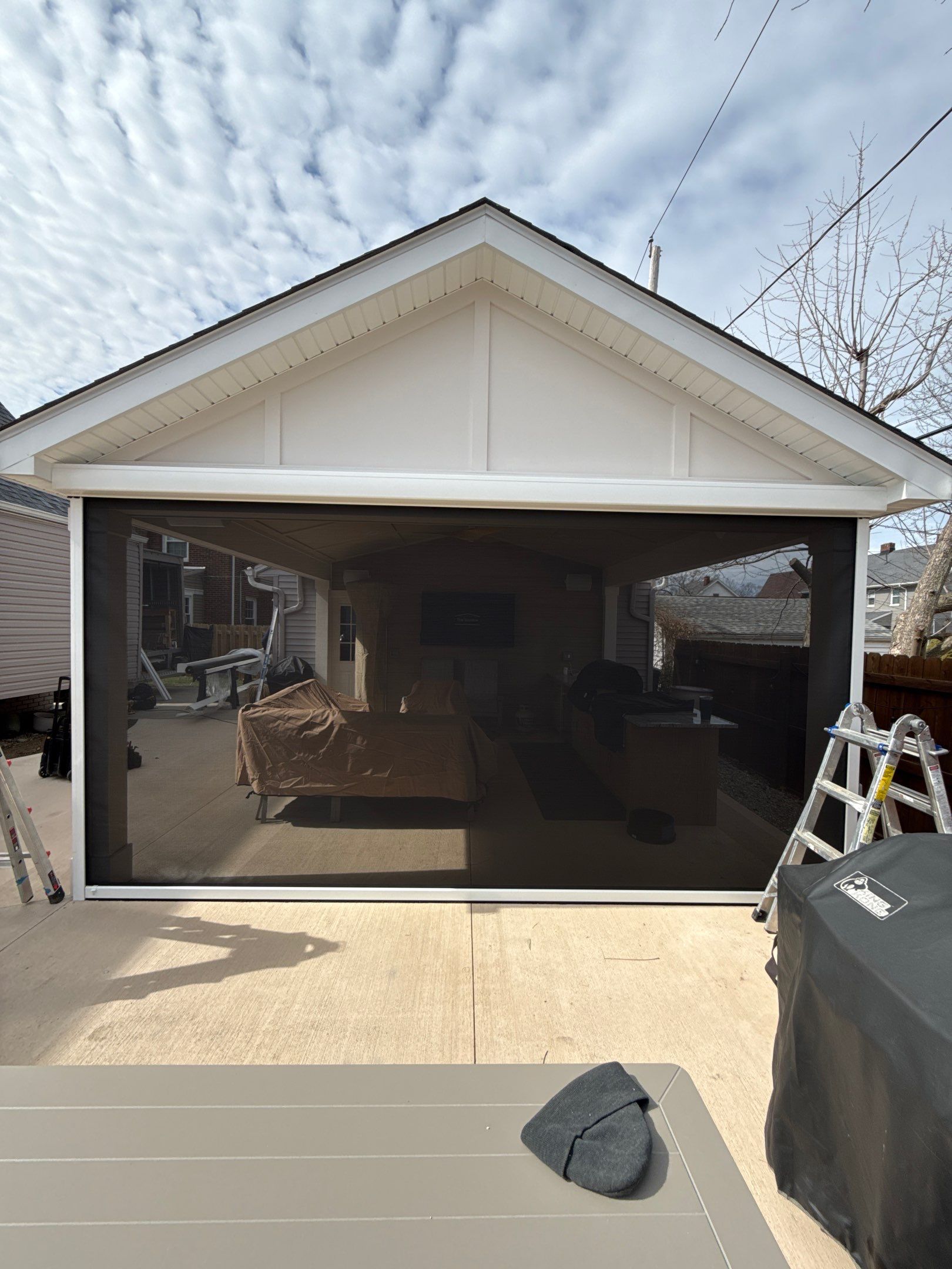 outdoor garage with black exterior screens