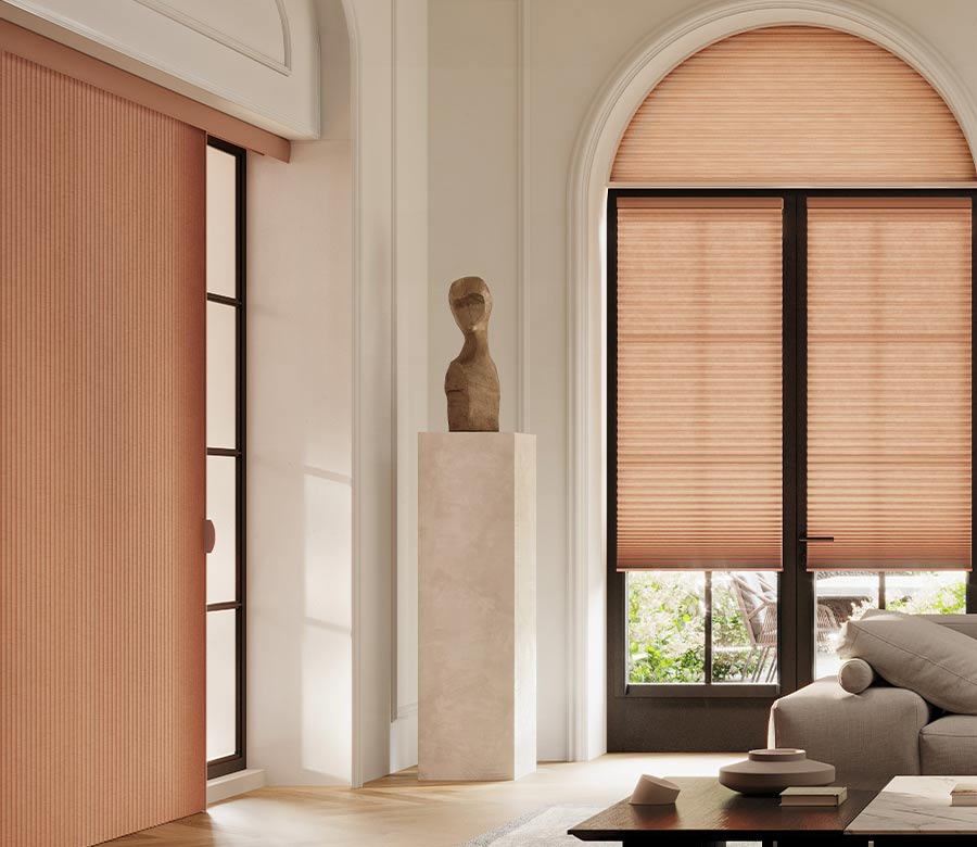 living room with peach duette vertiglide vertical honeycomb blinds