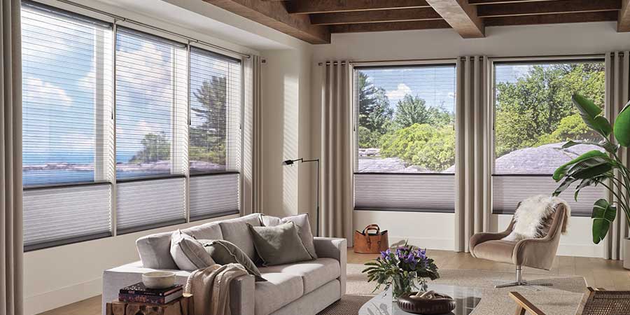 living room with cellular shade window coverings top down bottom up window coverings with custom drapery