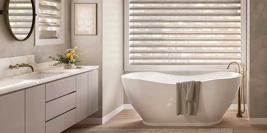 bathroom with white shades with tub pirouette shades