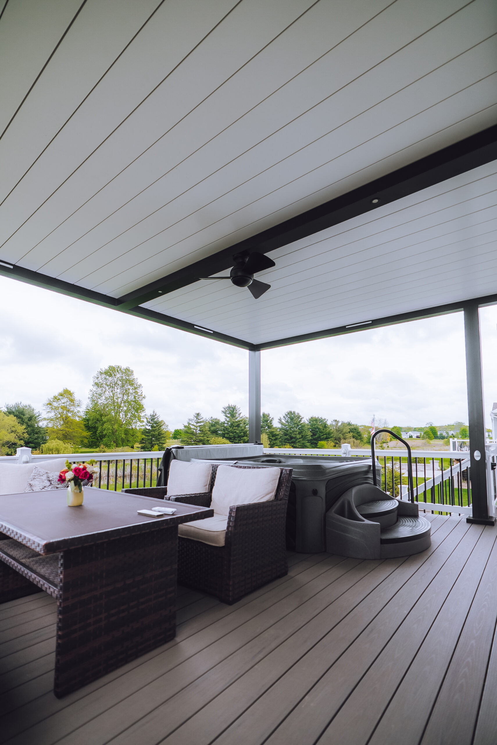 recent work in medina with a pergola with white louvers and black casing