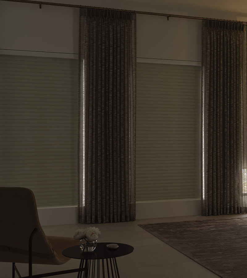 room darkening shades in bedroom paired with drapery at timan and co
