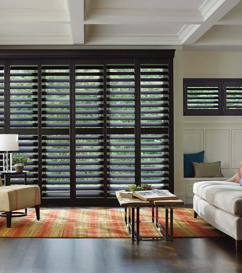 living room with black heritance shutters timan and co medina