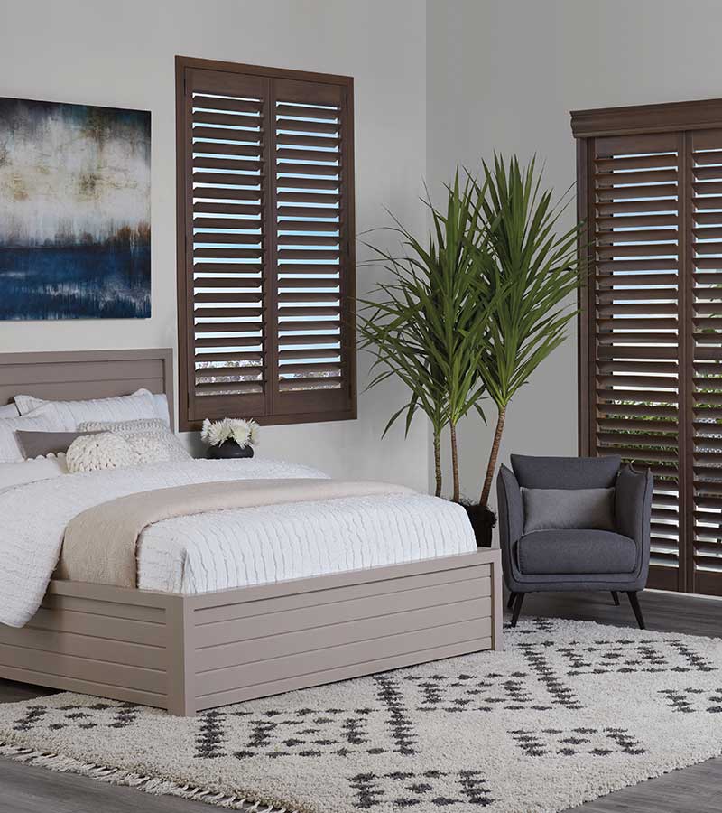 master bedroom with brown shutters timan and co