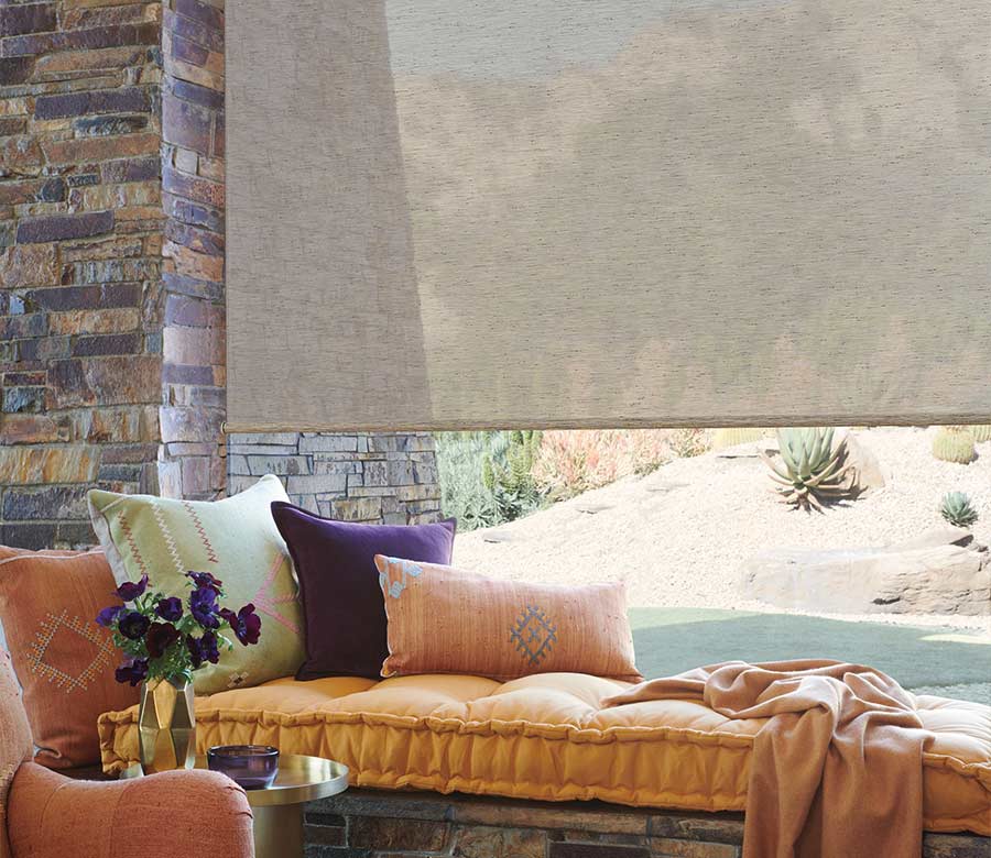 brown natural colored designer roller shades in living room for timan and co