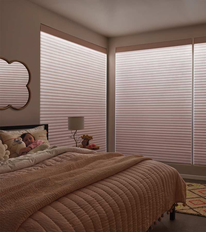 bedroom with aura illumination roller shades