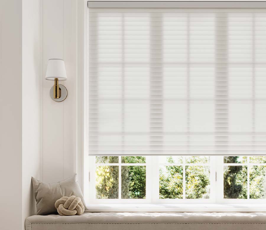 sonnette-shades-window-seat-light-gray-white-hinged-grid-windows-timan-and-co Hunter Douglas Sonnette® Cellular Roller Shades in white above a built-in window seat with hinged grid windows