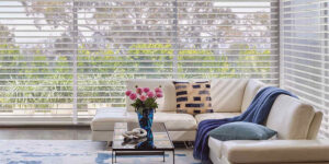 Sheer shades brighten large windows of living room windows