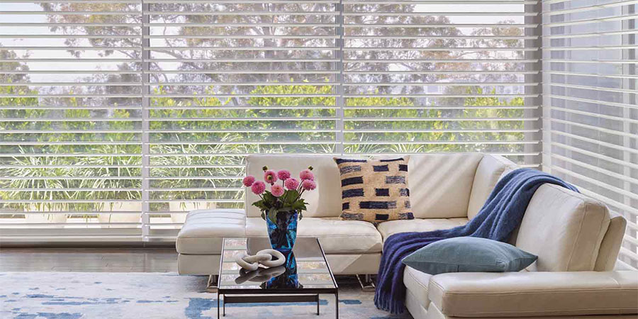 Sheer shades brighten large windows of living room windows